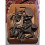 A box of metalwares to include irons, shoe lasts and scales.