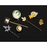 A collection of masonic stick pins and pin badges to include silver example.