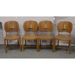 A set of four chinoiserie style dining chairs with painted geisha girl scene.