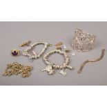 A quantity of mostly white metal costume jewellery including charm bracelets, bangle etc.