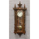 A 19th century mahogany cased single weight 30 hour Vienna wall clock.