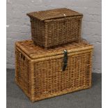 A large wicker work basket along with a wicker work fishing basket.