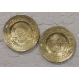 A pair of Chinese brass plaques depicting dragon and phoenix.