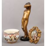 A gilt plaster figure of a maiden along with a Capodimonte bowl and a gilt framed oil on canvas.