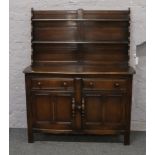 A dark oak Ercol dresser.