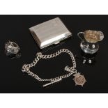 An Edwardian silver miniature cream jug, engraved cigarette case, Kings pattern spoon ring and a