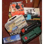 A collection of boxed power tools, some unused to include Bosch drill, Black and Decker jigsaw,