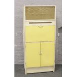 A 1960 painted kitchen cabinet with Formica worktop.