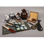A group of collectables to include Bakelite cased flask, hand fans, opium scale etc.