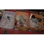 Three boxes of glassware to include bells, vases, decanter etc.