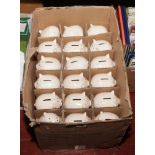 A box of pottery pig money boxes inscribed Congratulations.