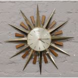 A Metamec sunburst clock made in England.