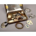 A tin of costume jewellery to include wristwatches, marcasite brooch, chains etc.