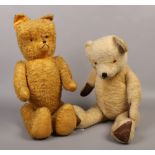 Two large vintage jointed teddy bears.