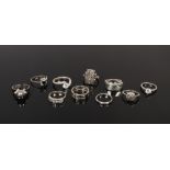 Ten silver rings including marcasite panel ring etc.