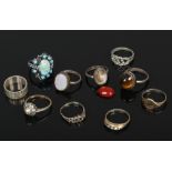 Ten silver and white metal dress rings to include large coloured paste stone set examples etc.