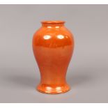 A Moorcroft orange lustre baluster shaped vase. Impressed mark, 15cm.Condition report intended as