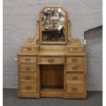 A Victorian stripped pine dressing table with later mirror.