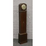 An oak cased Enfield grandmother clock with silvered dial and chiming on a coiled gong, no