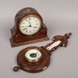 An 8 day mahogany cased dome top mantle clock by Comitti London chiming on a bell, along with an