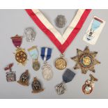 A collection of masonic badges to include silver World War I embroidered examples etc.
