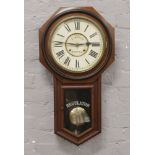 A mahogany cased drop dial regulator wall clock with label to interior; Ansonia Clock Company New
