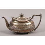 A George III silver teapot, assayed London 1815, 450 grams.