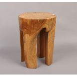 A naturalistic hardstone stool.