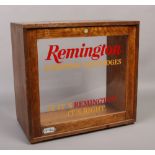 An oak display case later stencilled for Remington sporting cartridges.