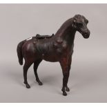 A French leather clad model of a horse with glass eyes.