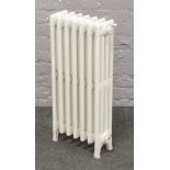 A working vintage cast iron radiator, 76cm high x 38cm wide,