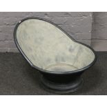 A vintage tin hip bath tub.