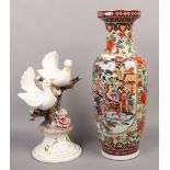 A large decortive Chinese baluster shape vase, 60.5cm along with a Capodimonte figure group of two