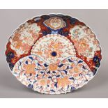 A japanese Meiji period Imari fluted oval dish.Condition report intended as a guide only.Restored.