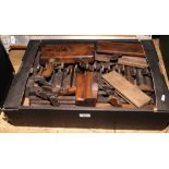 A box of antique joiners moulding planes.