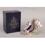 A Royal Crown Derby exclusive commission Coral Seahorse paperweight with gold stopper.