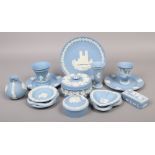 A collection of blue Wedgwood Jasperware to include trinket boxes, dishes, vases, cabinet plates