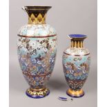 Two Royal Doulton Slaters patent stoneware vases with floral decoration, tallest 46cm high.