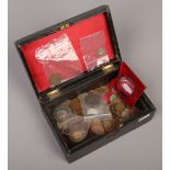 A box of British and foreign pre-decimal coins to include three pence, pennies, commemorative crowns