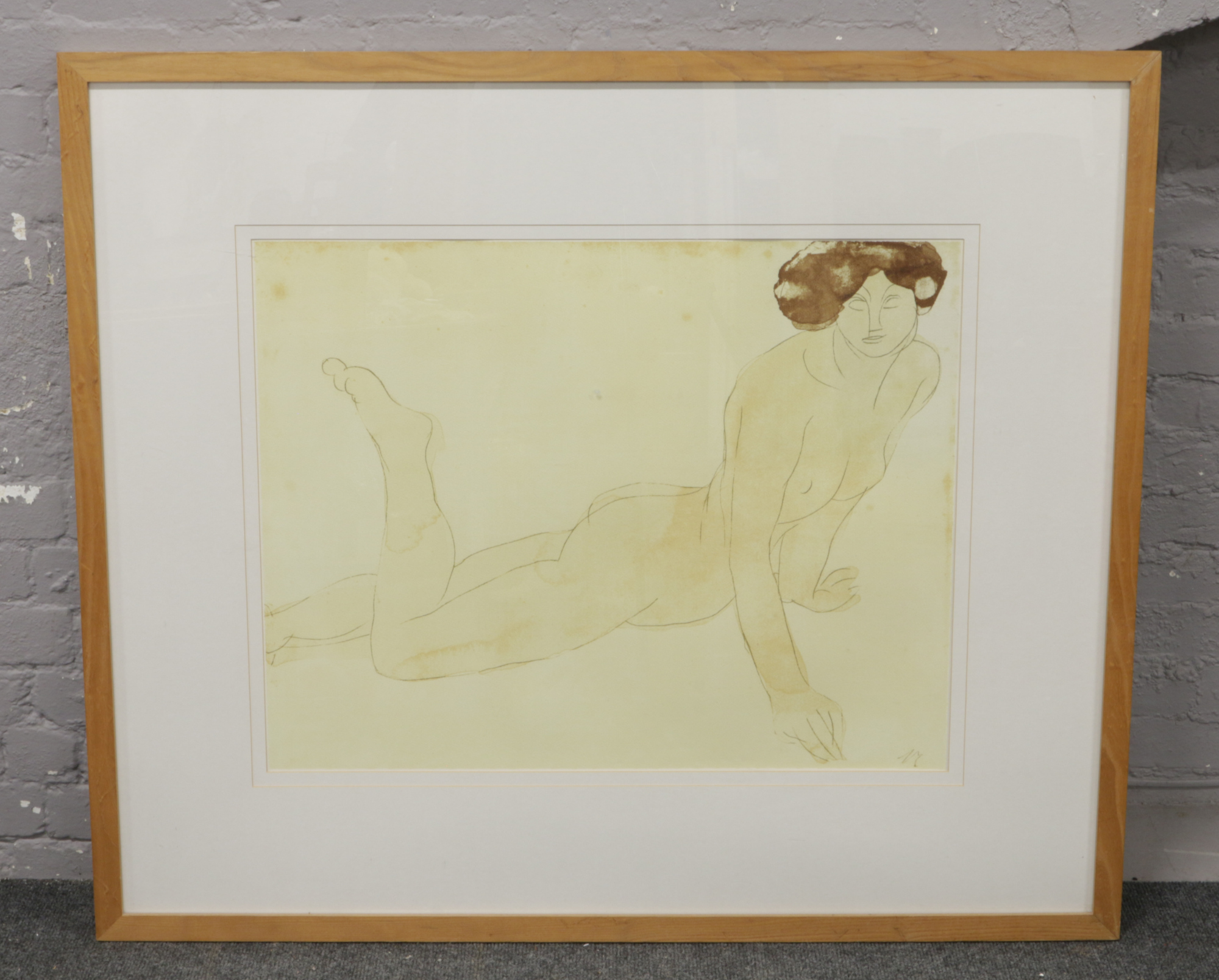 A large print after Auguste Rodin 'Femme Nue Allongee Sur Le Ventre' 90cm x 70cm.