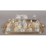 A tray of Swarovski crystal to include large palm trees, animals, pineapple etc.