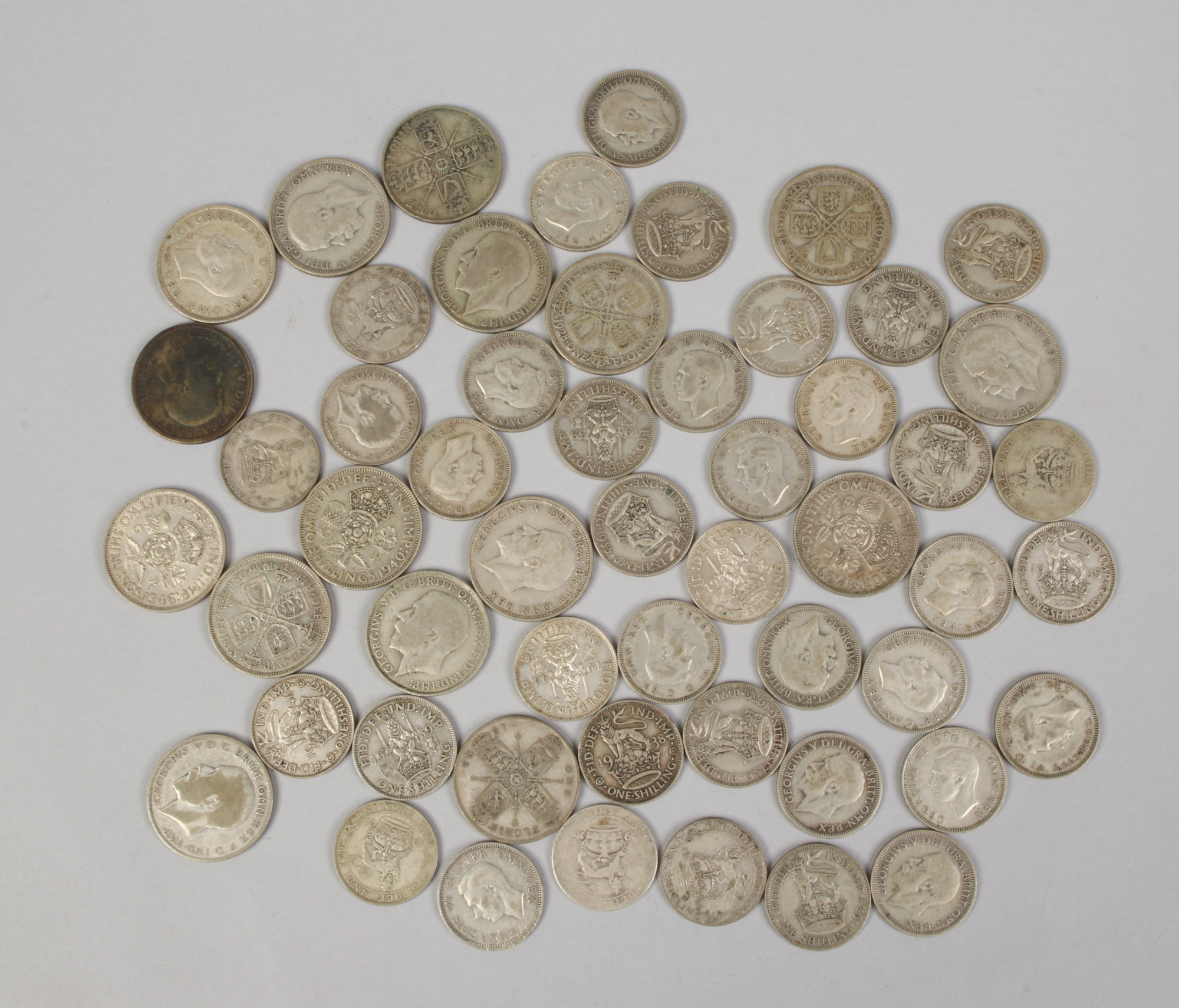 A quantity of pre-decimal coins, 38 shillings and 16 florins.