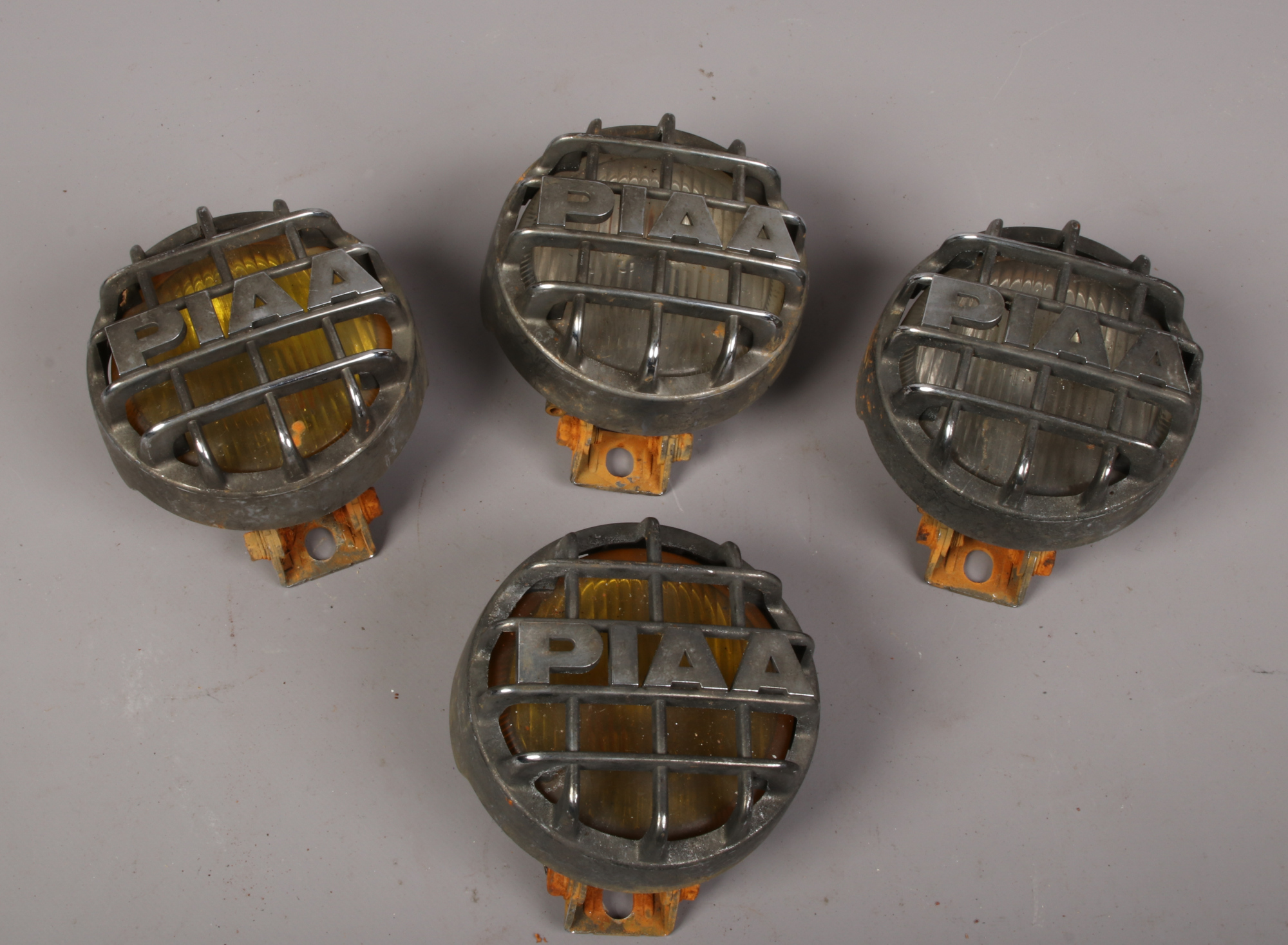 Four PIAA car fog lights.