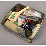 A tin of collectables to include signed snooker ball , pens, magnifying glass, black ink etc.