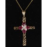 A 9ct gold crucifix and chain set with rubies and diamonds.