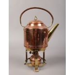 A copper and brass spirit kettle.