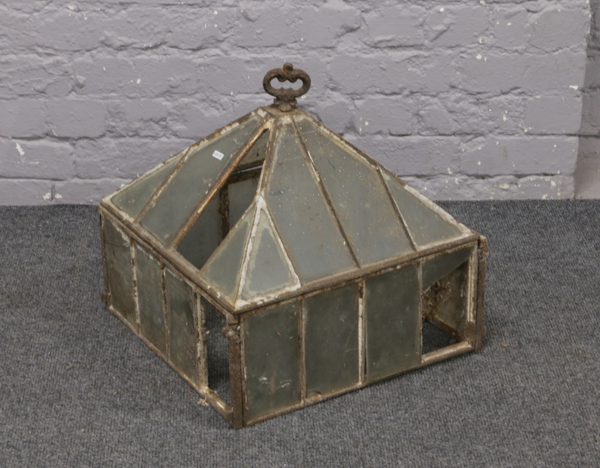 A Victorian iron and glass garden cloche (AF).