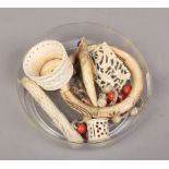 A quantity of carved bone and ivory collectables including pendant on chain strung with carved coral