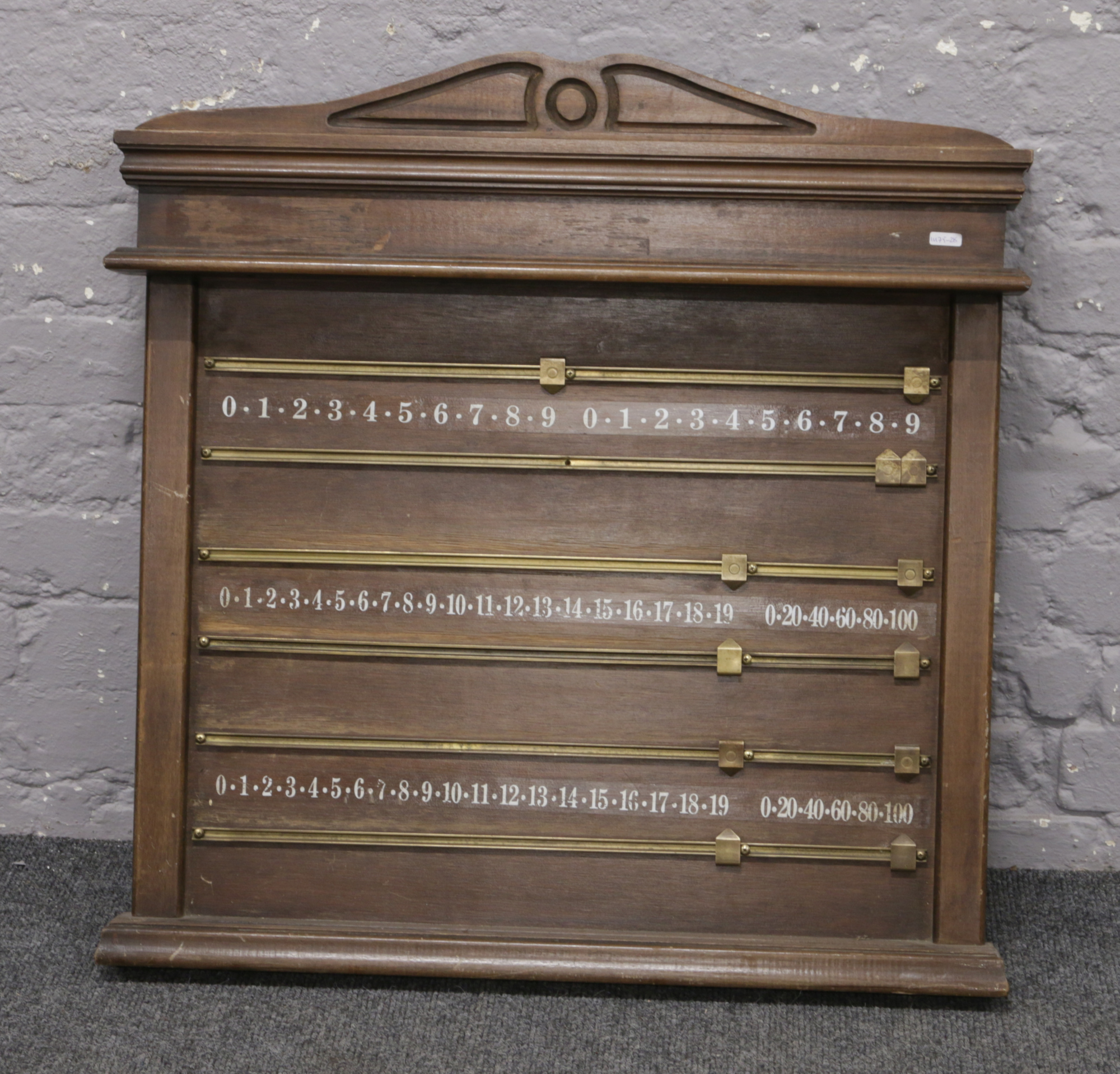 A mahogany wall mounting snooker scoreboard.