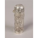 A Victorian silver scent bottle with glass liner and extensive floral and scrollwork repousse